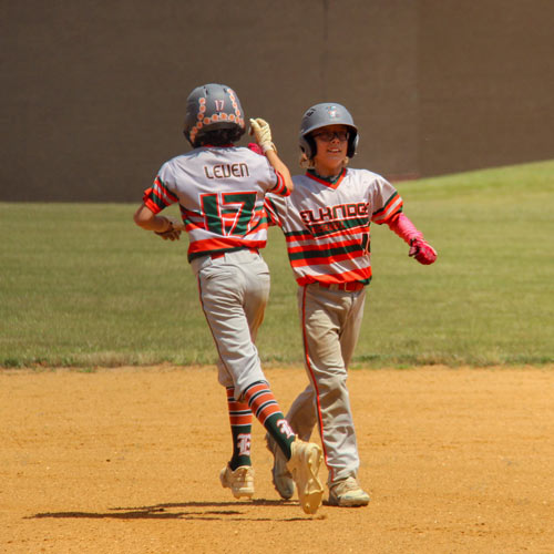 Hudson Leven giving Brayden Centineo a pound as he runs past him to be his pinch runner.