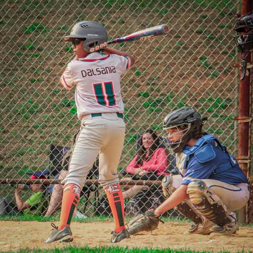 An Elkridge Hurricane batter stands in the box with the catcher behind him, awaiting the pitch.